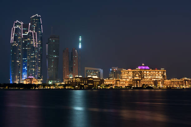 istock Abu Dhabi buildings skyline from the sea at night 839807192