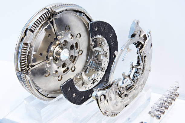 Clutch system with dual mass flywheel Clutch system with dual mass flywheel, pressure plate and concentric slave cylinder fly wheel stock pictures, royalty-free photos & images
