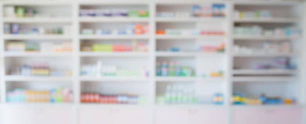 blur pharmacy store shelves blur pharmacy store shelves filled with medicines arranged in shelves at pharmacy, pharmacy background concept over the counter meds stock pictures, royalty-free photos & images