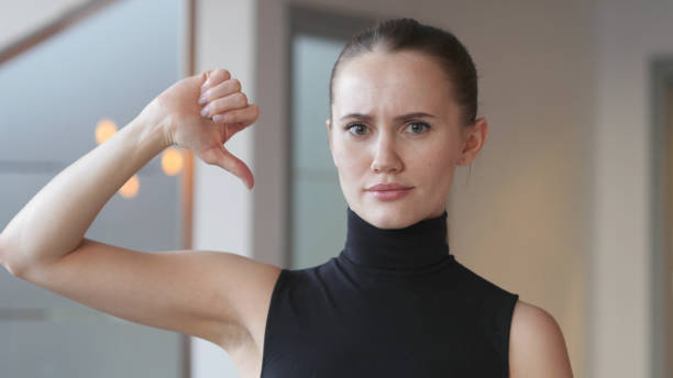 istock Thumbs Down by Woman in Office 839818830