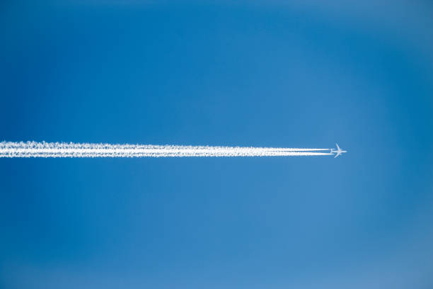 istock jet plane in the blue sky with contrail 839819950