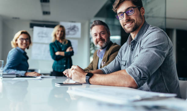 istock Businesspeople sitting in conference room 839820104