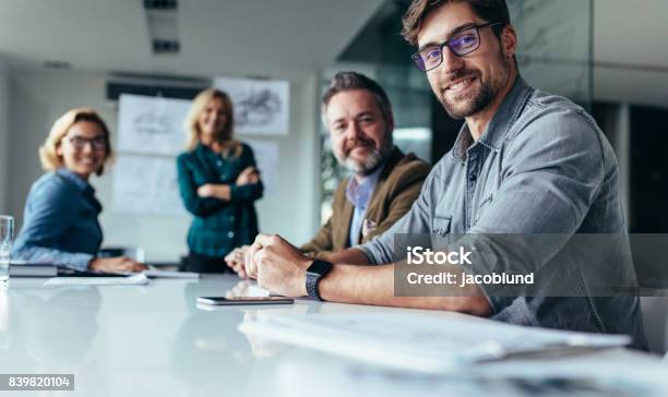 Businesspeople Sitting In Conference Room Stock Photo - Download Image Now - Business, Office, Teamwork