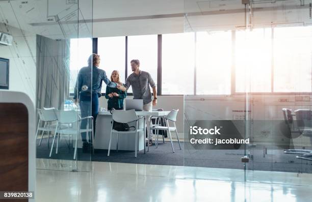 Businesspeople Shaking Hands After Successful Meeting Stock Photo - Download Image Now