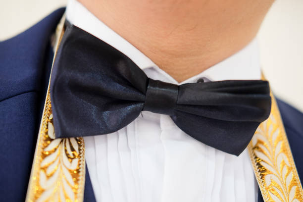 istock Stylish groom with bow tie getting ready in the morning 839825270