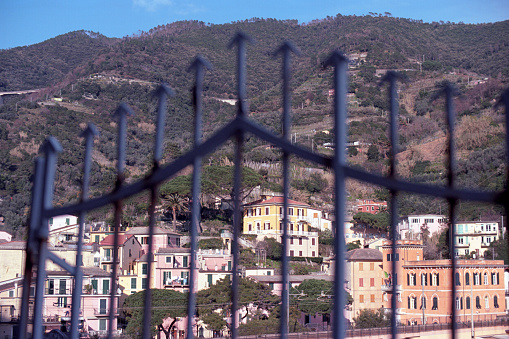 Monterosso al Mare, Ligury, Italy, as seen in the background of a spiked metal gate