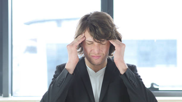 istock Headache, Upset Man In His Office 839829438