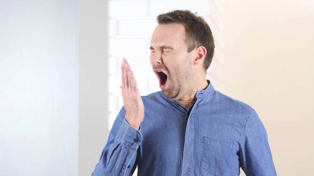 istock Yawning Tired Middle Aged Man 839830324