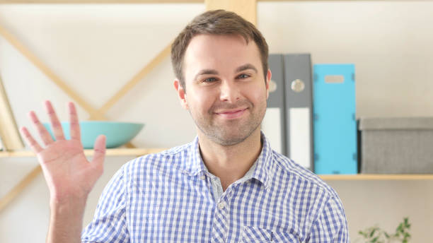 istock Hello by Man, Sitting in Office and Waving Hand 839833560