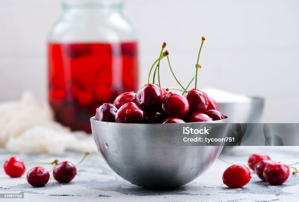 cherry cherry compot  and fresh cherry in metal bowl Appetizer Stock Photo