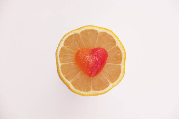 istock Red heart on the middle of lemon slice. 839840612
