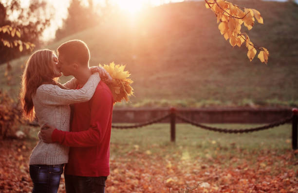 istock couple kissing in autumn park 839842006