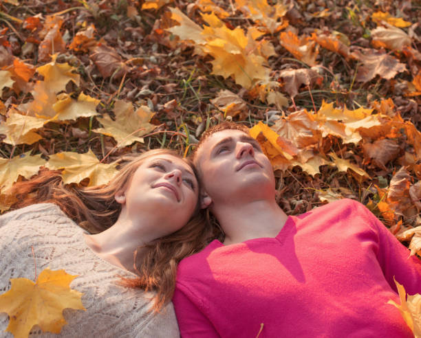 istock romantic couple in the autumn park 839842020