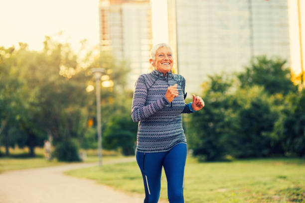 istock Senior woman jogging in the park 839846418