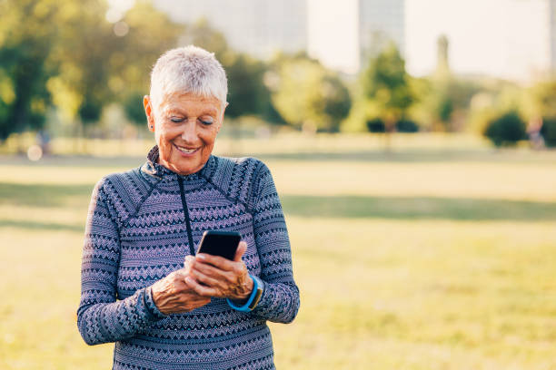istock Senior sportswoman using a smart phone 839846420