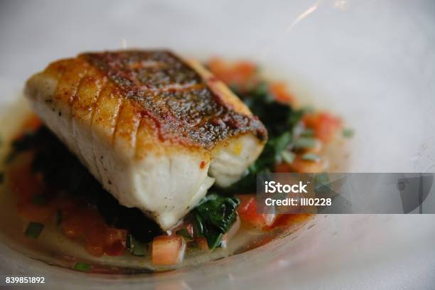 Seared Sous Vide Cod Filet On A Bed Of Vegetables Stock Photo - Download Image Now - Seared, Cod, Fish