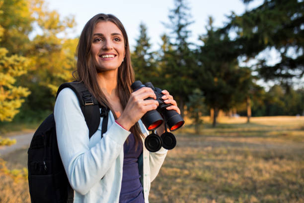 istock Young pretty girl with binoculars 839852228
