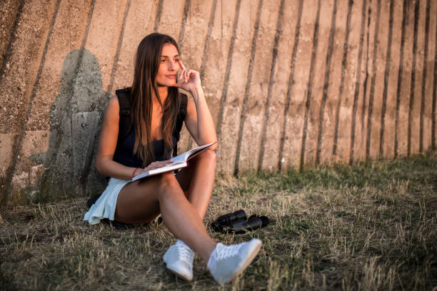 istock Female hiker reading a book in nature 839853068