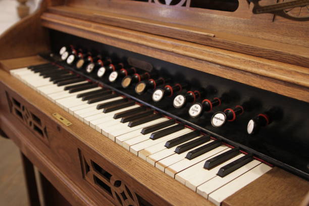 istock old styled and retro vintage harpsichord as background - very low DOF. 839860738
