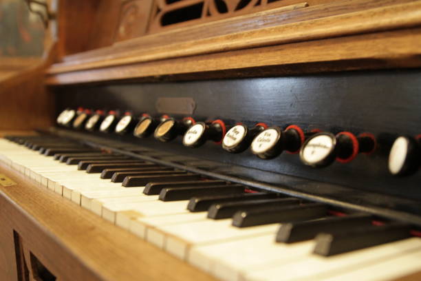 istock old styled and retro vintage harpsichord as background - very low DOF. 839860756
