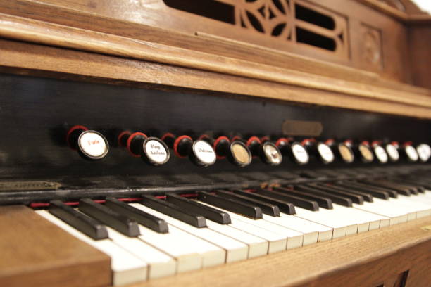 istock old styled and retro vintage harpsichord as background - very low DOF. 839860776