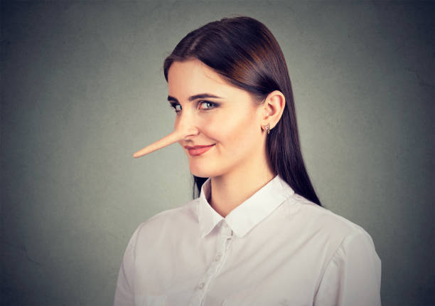 Liar sly funny looking young woman Liar sly funny looking young woman falsehood stock pictures, royalty-free photos & images