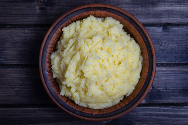 istock Mashed potatoes in a plate on the wooden table 839878816