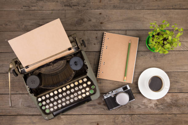 istock Vintage typewriter on the old wooden desk 839879028