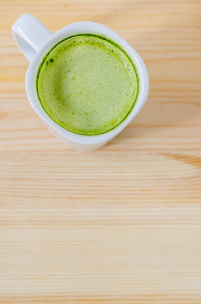 istock Milk green tea on wooden table 839879036