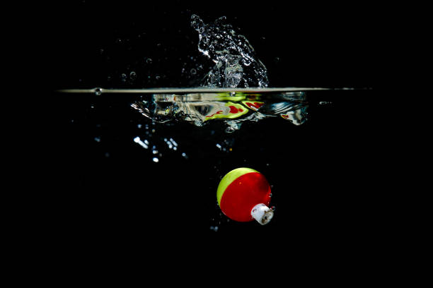 Colorful Fishing Bobber Makes a Splash stock photo