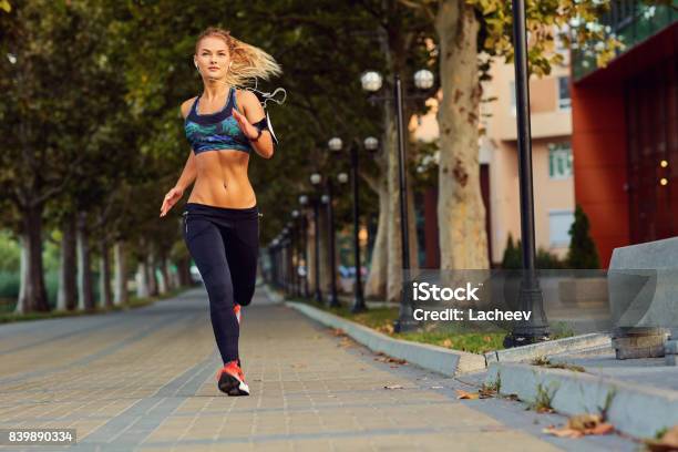 Young Athletic Girl Runner Jogging In Park In Summer Autumn Stock Photo - Download Image Now