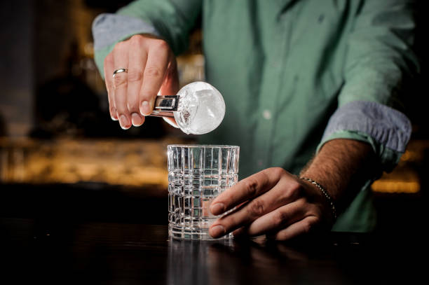 istock A professional bartender is holding an ice ball. 839893518