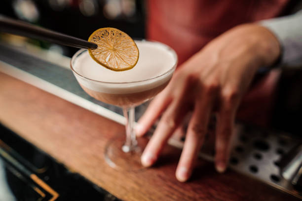 istock Sicilian sour cocktail in bartenders hands 839894362
