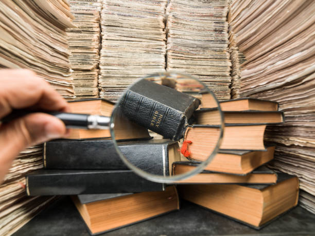 istock Holy Bible Seen In Library Through Magnifying Glasses 839900004
