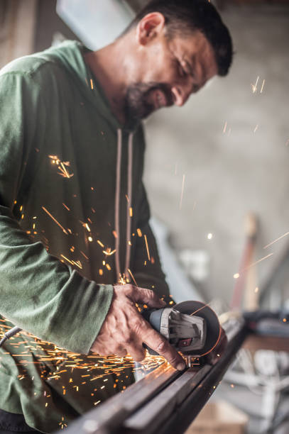 istock Electric wheel grinding on steel structure in factory 839900114