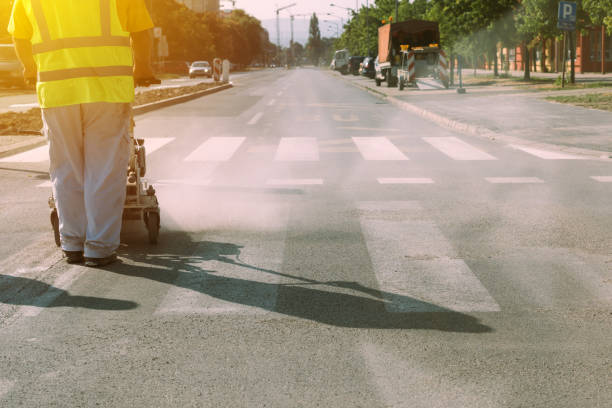 istock Worker is painting zebra pedestrian crosswalk 839900342