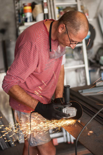 istock Electric wheel grinding on steel structure in factory 839900372