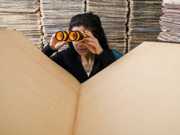 Young Mixed Race Woman Doing Research In Library