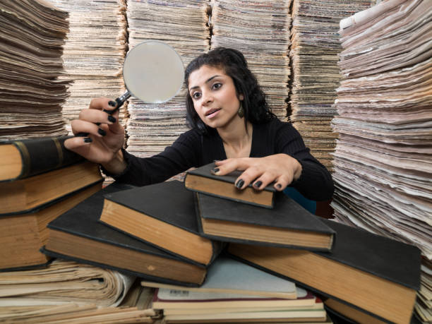 istock Young Mixed Race Woman Doing Research In Library 839900778