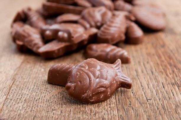istock shell-shaped chocolates pralines assortment on wooden table 839901028