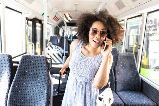 istock Tourist with suitcase using smart phone inside of bus 839905412