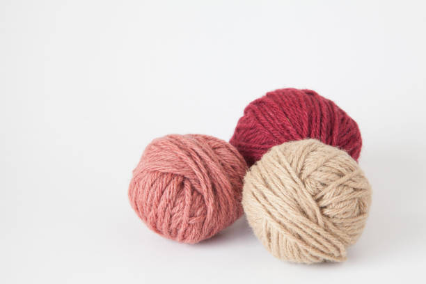Ball of yarn on white background