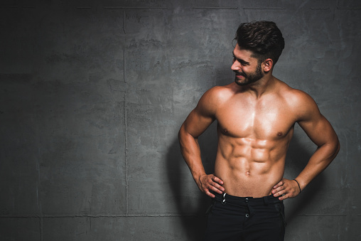 Shot of a handsome and muscular young man posing shirtless in the studio.