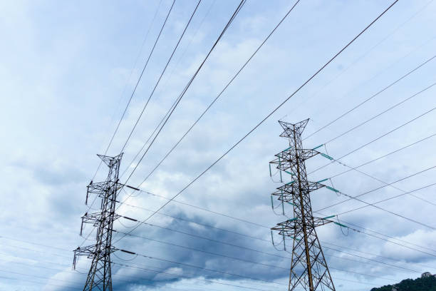 istock high voltage electricity pylon with cloudy sky at dusk background. 839914514