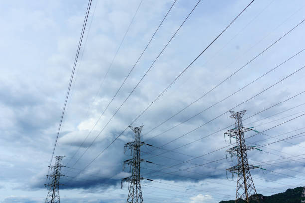 istock high voltage electricity pylon with cloudy sky at dusk background. 839914574