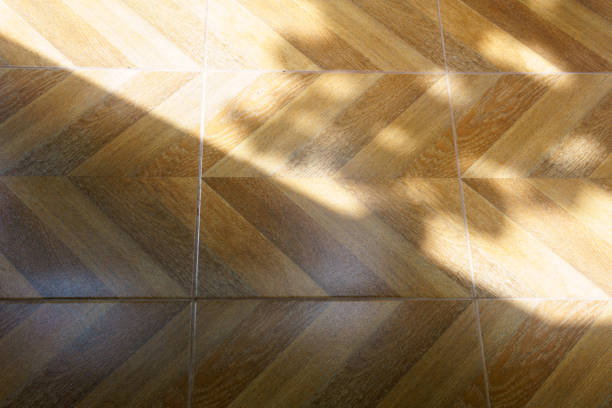 istock abstract wooden or laminate floor with sun light 839915502