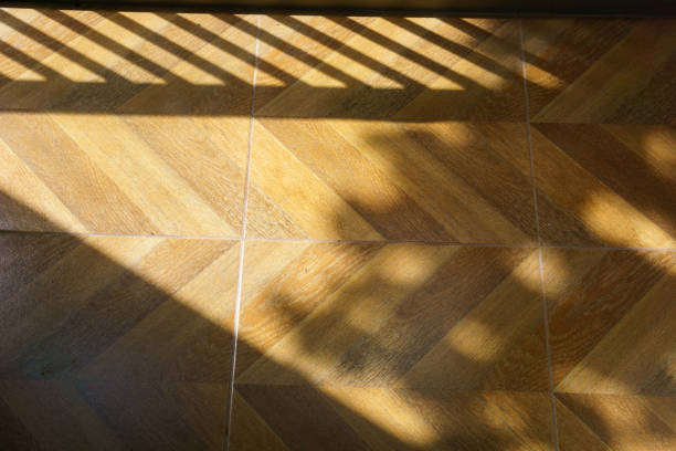 istock abstract wooden or laminate floor with sun light 839915508