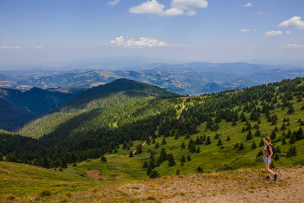 Woman hiking alone in the mountains