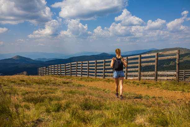 Woman hiking alone in the mountains