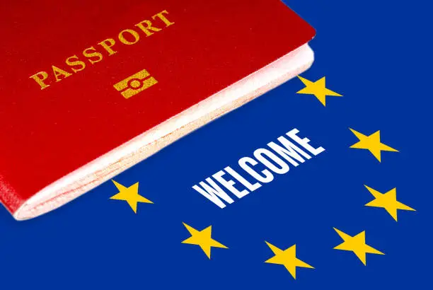 welcome, white text over eu flag and passport